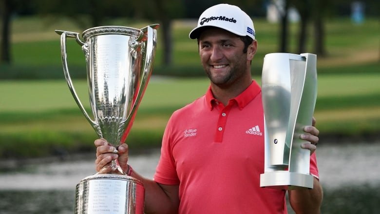 Jon Rahm with BMW trophies