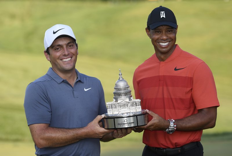 Defending Quicken Loans National champ Francesco Molinari with Tiger Woods
