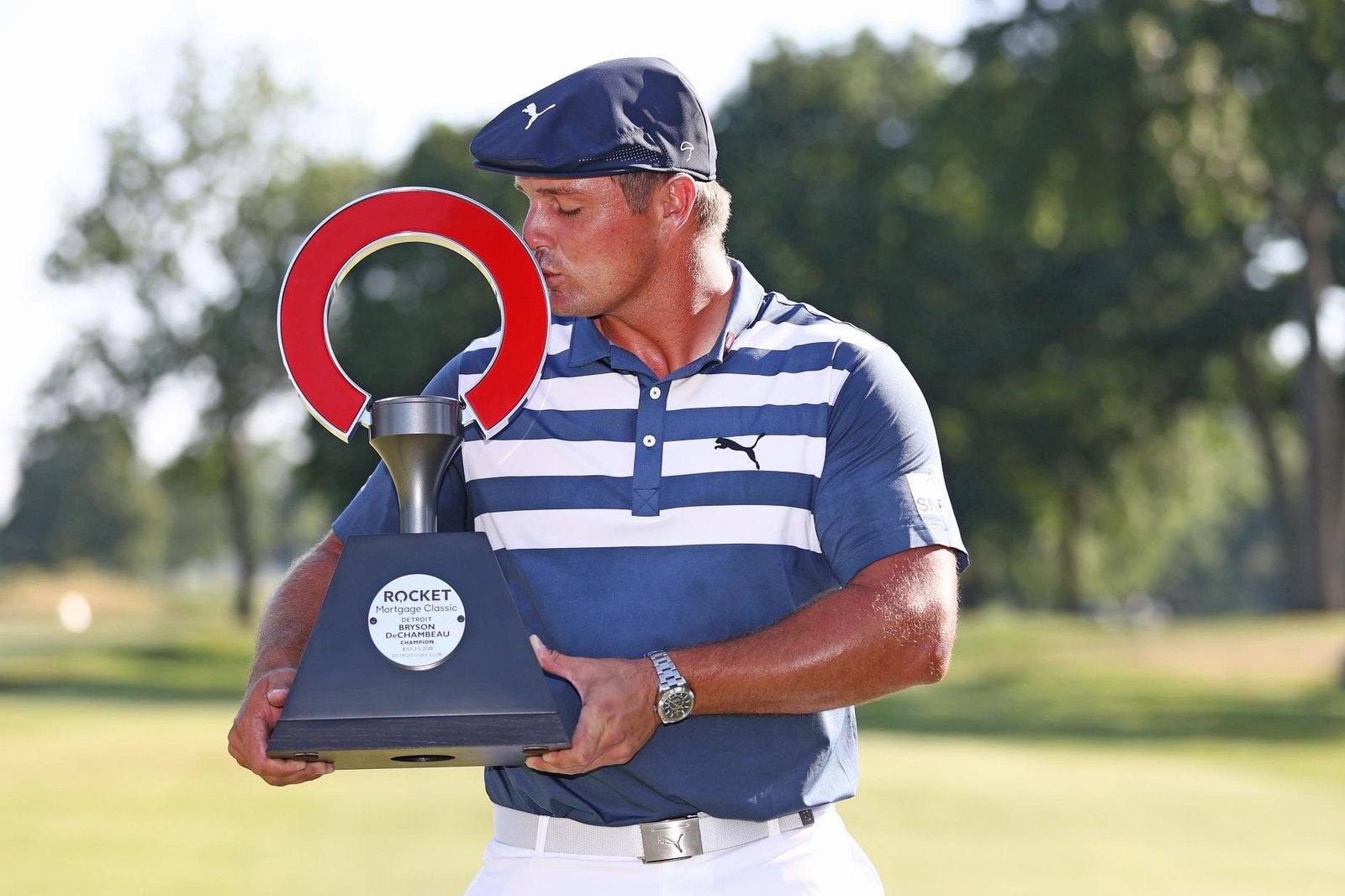 Bryson DeChambeau with the Rocket Mortgage trophy