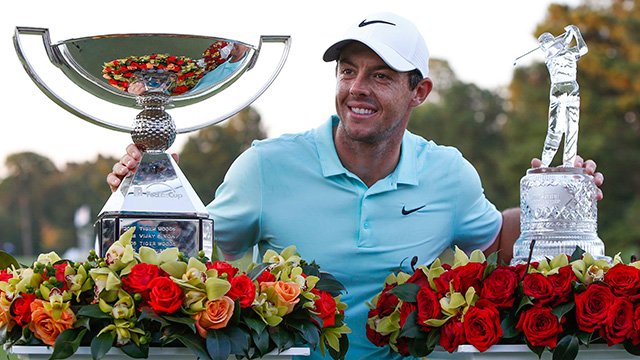 Rory McIlroy with FedExCup and Tour Championship trophies