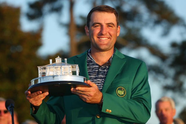 Scottie Scheffler with Masters trophy and Green Jacket