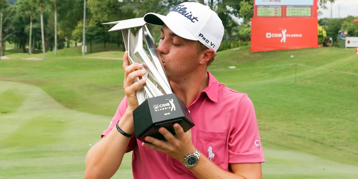 JT kisses his 2nd CIMB trophy