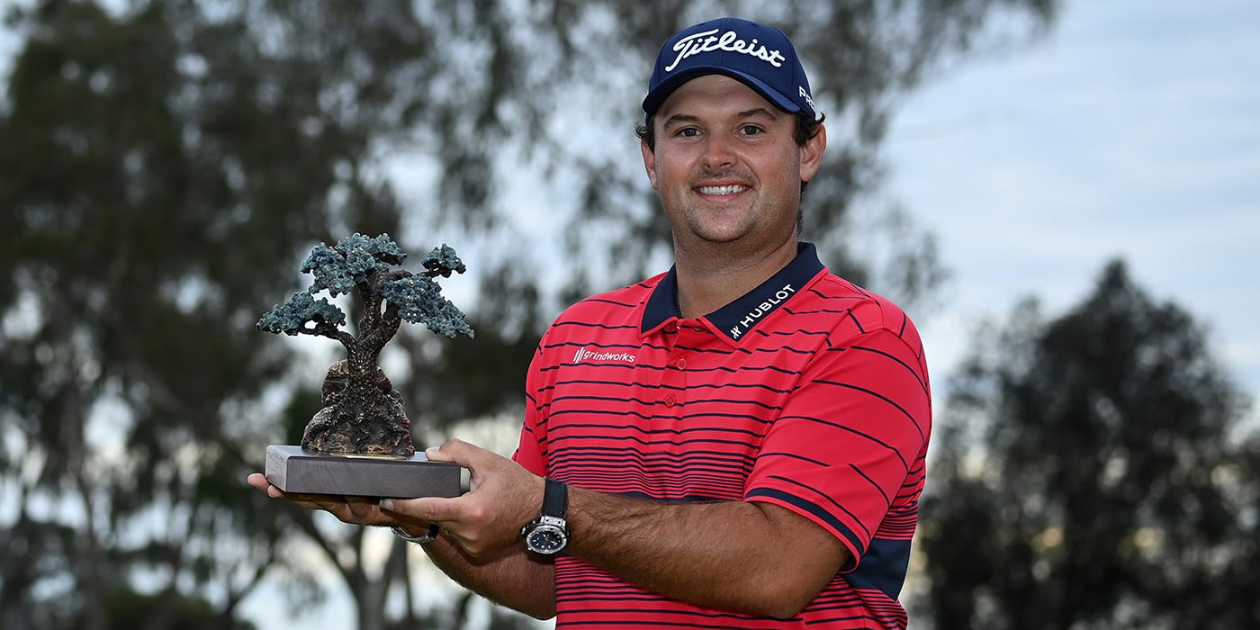 Patrick Reed with Farmers trophy