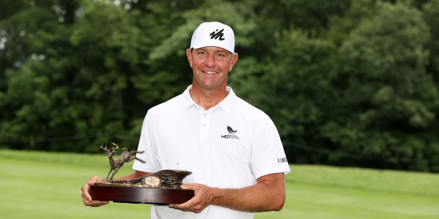 Lucas Glover with John Deere trophy