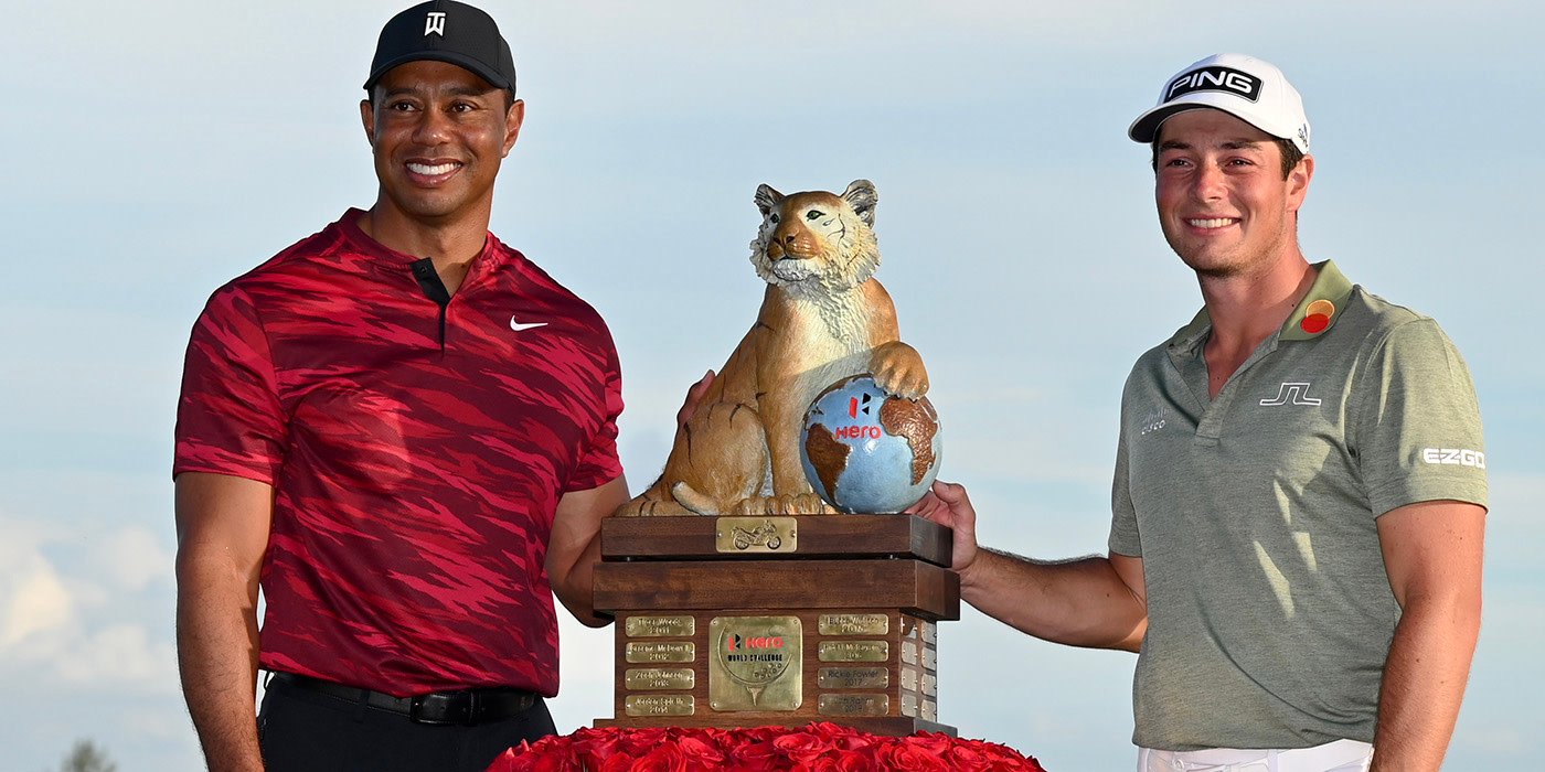 Viktor Hovland with Tiger and the Hero trophy
