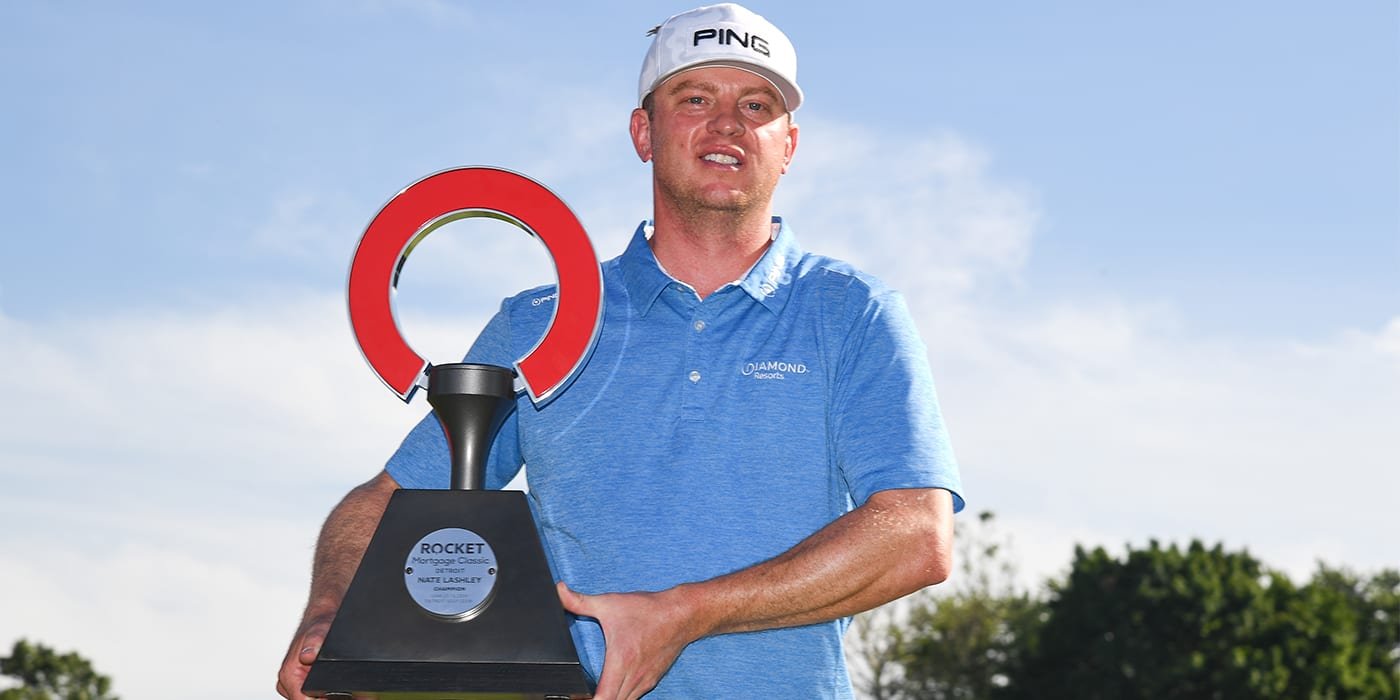 Nate Lashley with the Rocket Mortgage Classic trophy