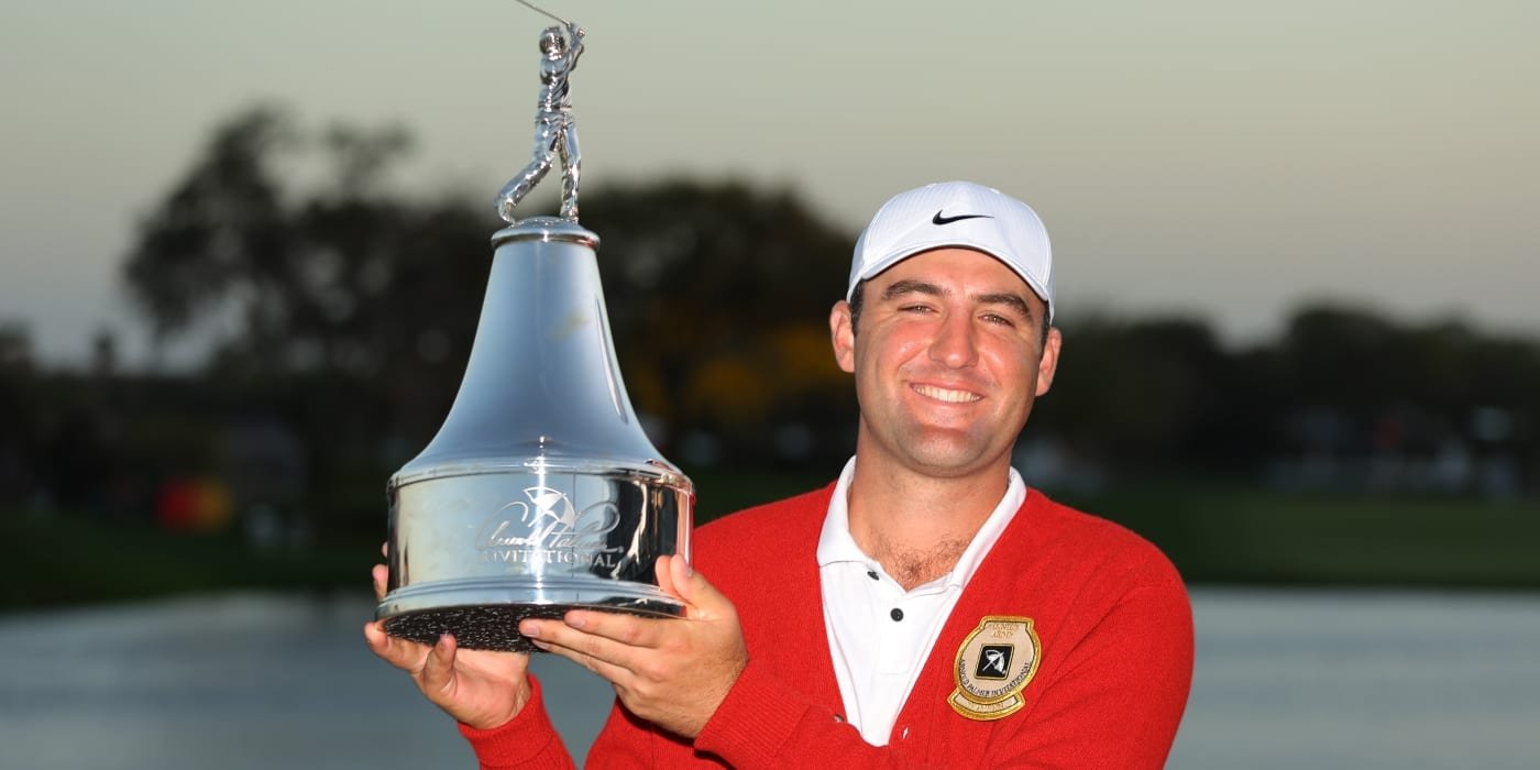 Scottie Scheffler with API trophy and red sweater
