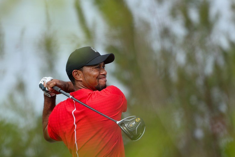 Tiger hitting a driver
