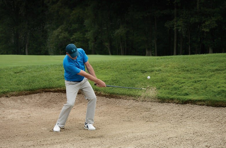 Will Robins hitting sand from a bunker