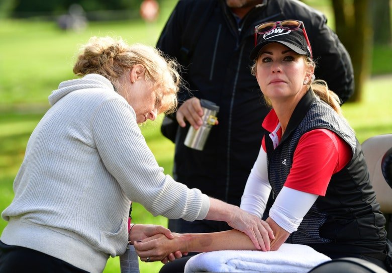 Paula Creamer gets medical attention at Evian