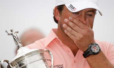 Graeme McDowell holding U.S. Open trophy at Pebble Beach