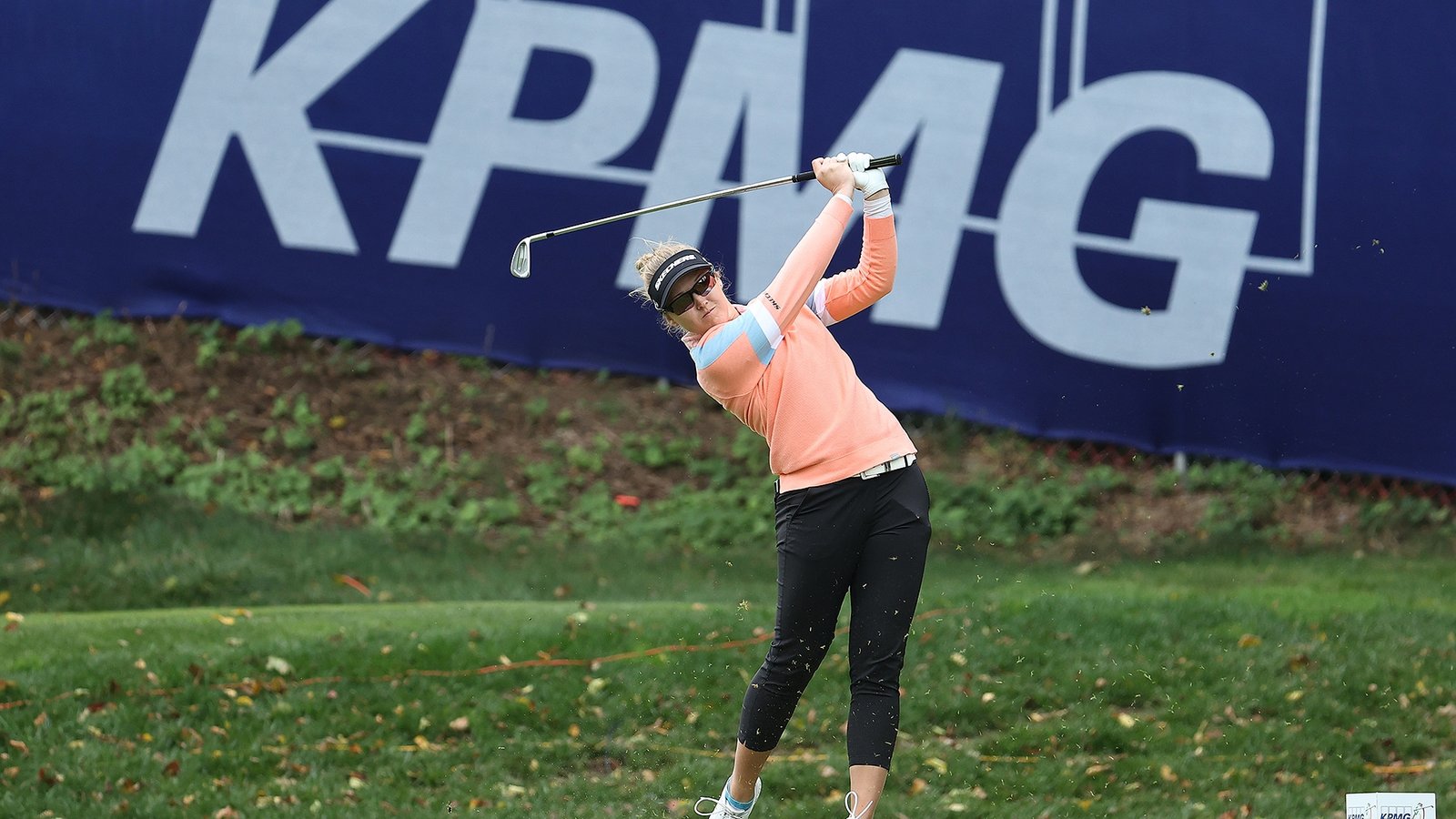 LPGA player and KPMG banner