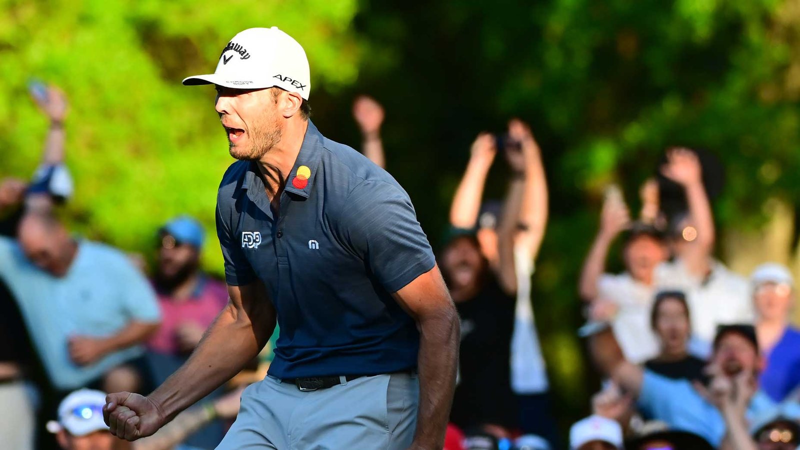 Sam Burns reacts to winning putt in playoff